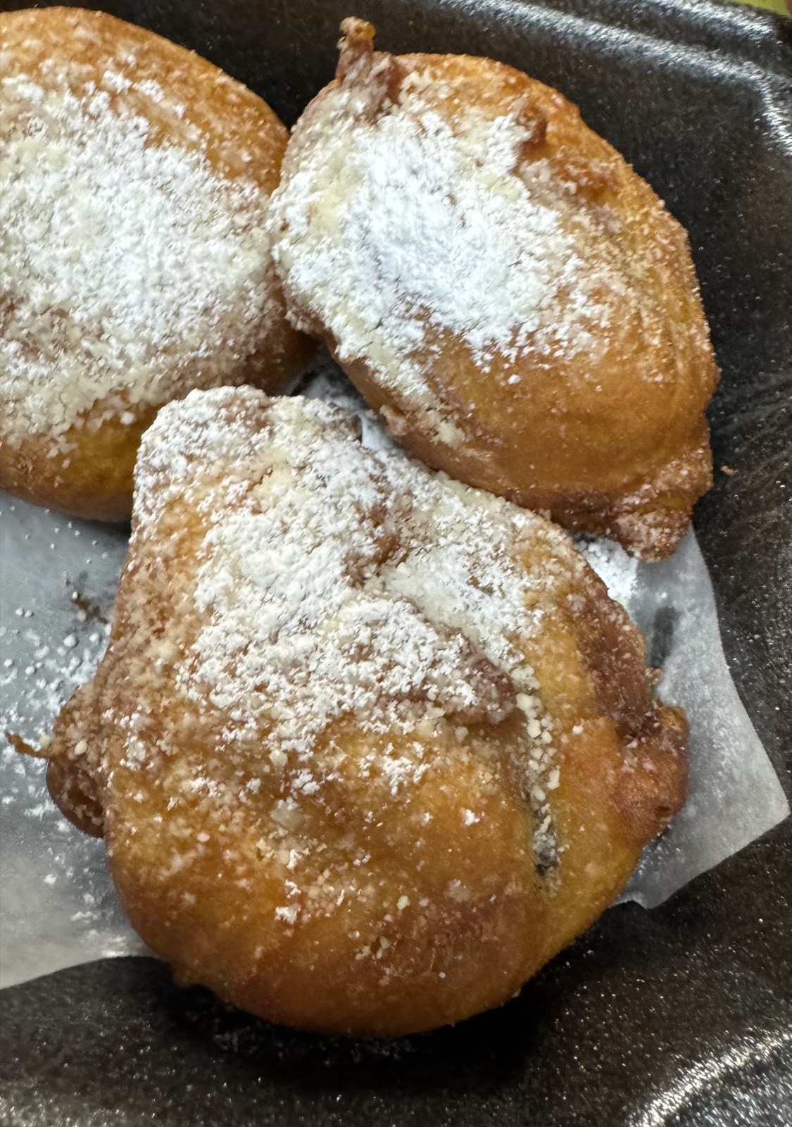 Fried Oreos dusted with powdered sugar